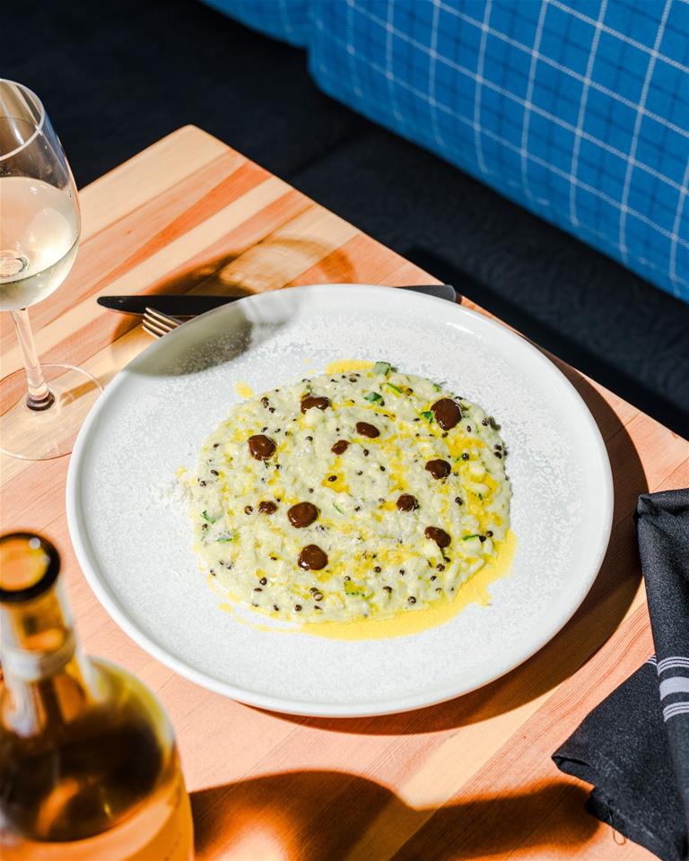 F&B Restaurant - Local and seasonal, their risotto features garden zucchini, and Saskatchewan black lentils, with a fragrant black garlic purée.