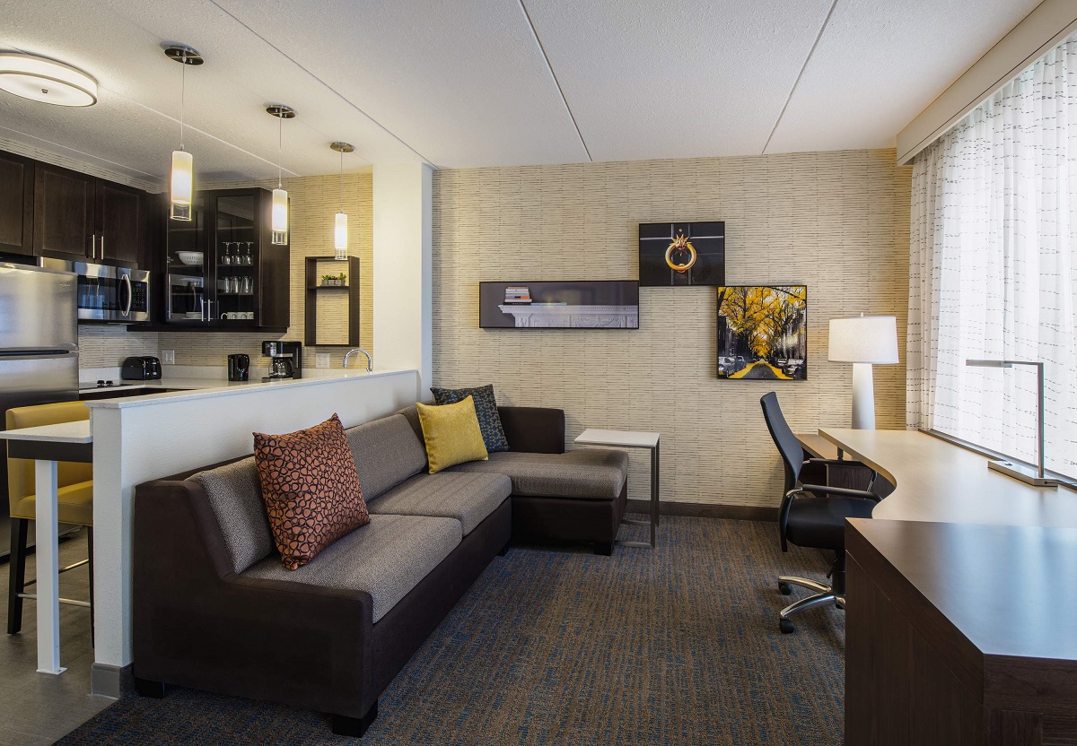 Residence Inn by Marriott Regina - The living and kitchen area of the Studio King