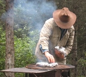 Richard roasting fresh corn at Camp Lake 