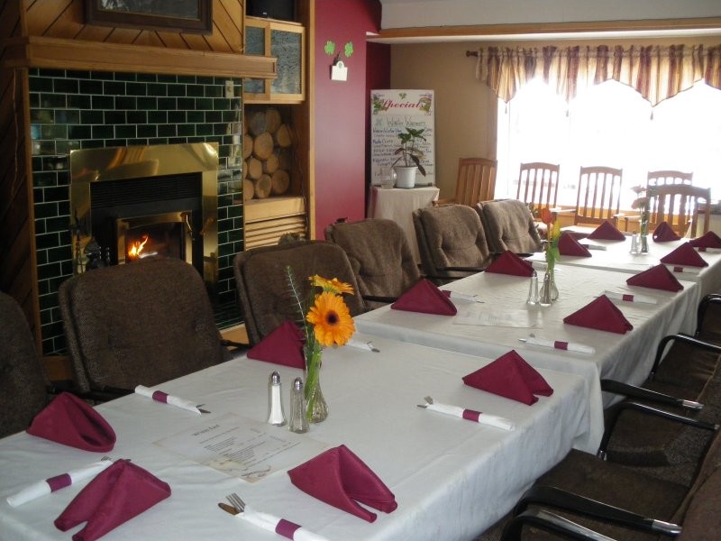The Beach House Family Restaurant - Cozy up to the fire at Sunset Bay Resort