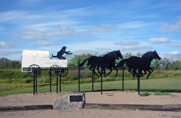 'Coming Round the Barrels' which celebrates our chuckwagon heritage and gives character to the north end of Main Street. 

